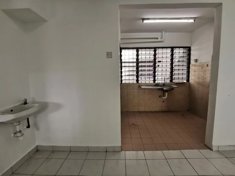 Room features: white painted walls, tile flooring, single-bowl sink, wall-mounted faucet, window with metal grilles, countertop, light fixture on ceiling.