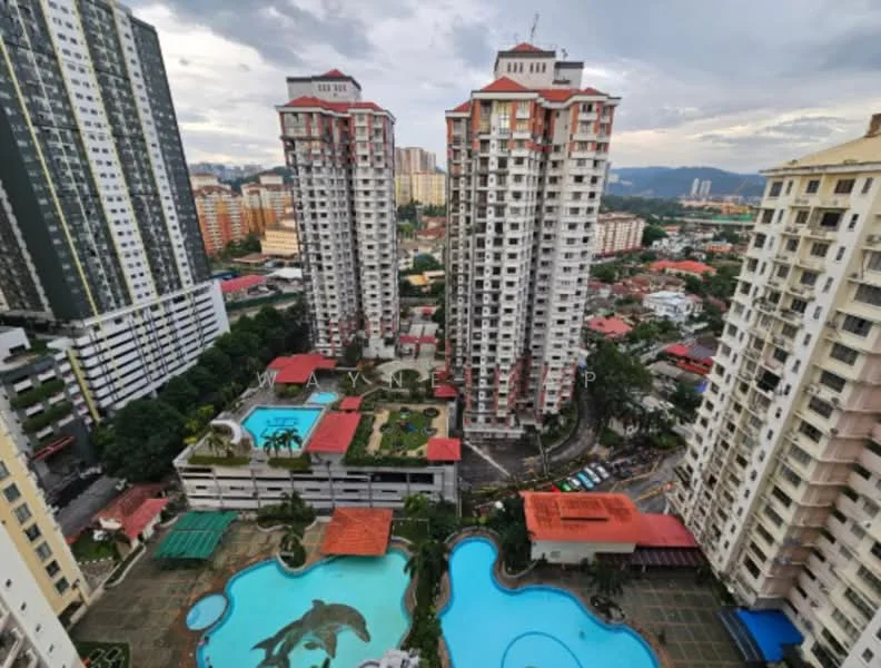 Exterior type: high-rise condominium; features: multiple high-rise buildings, swimming pools, landscaped gardens, pool deck with loungers, children's playground, manicured lawns, surrounding urban landscape, city skyline in background; style: modern.