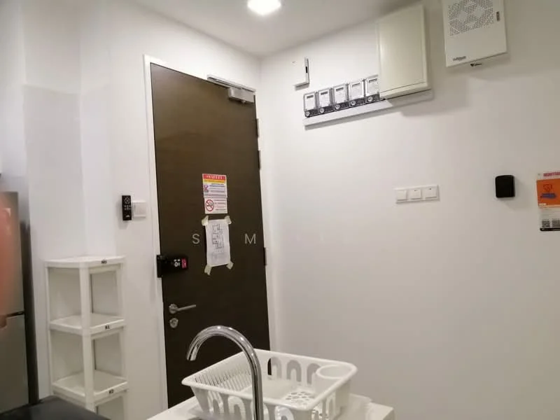 Room features: white painted walls, light-colored ceiling, door with a dark wood finish, electrical panel on wall, wall-mounted air conditioning unit, shelf unit with open shelving, sink with faucet, basket for storage; style: modern.