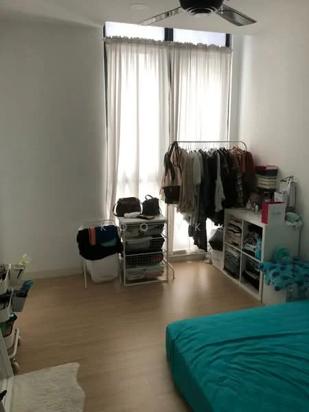 Bedroom features: light wood flooring, white painted walls, floor-to-ceiling windows, sheer curtains, 5-blade ceiling fan, queen-size bed with teal bedding, clothing rack with hanging clothes, open shelving unit with storage boxes, laundry basket, area rug; style: modern.