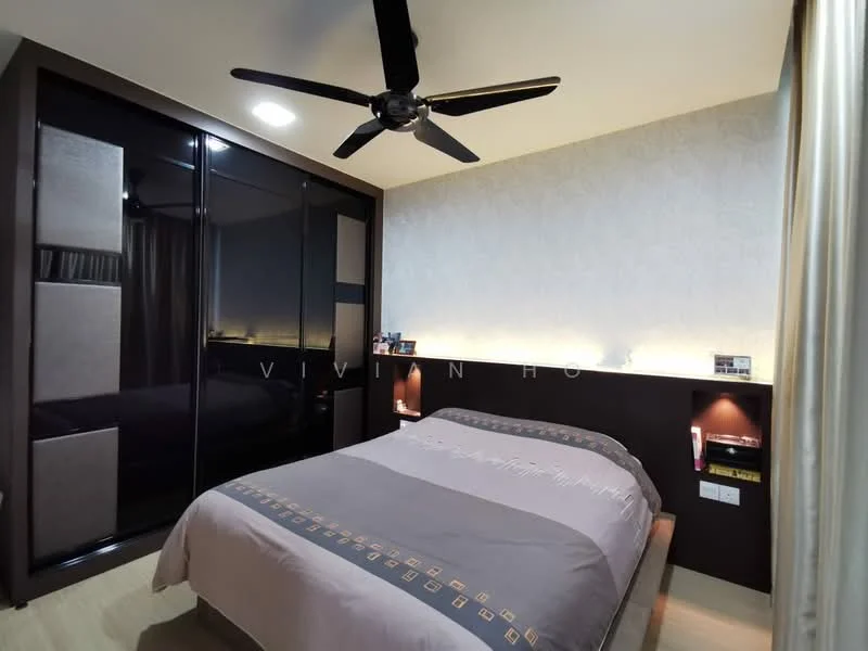 Bedroom features: king-size bed with grey bedding, upholstered headboard, built-in wardrobe with sliding doors, ceiling fan with light, wall-mounted bedside lamps, decorative wall with soft lighting, wooden flooring, curtains, nightstand with books; style: modern.