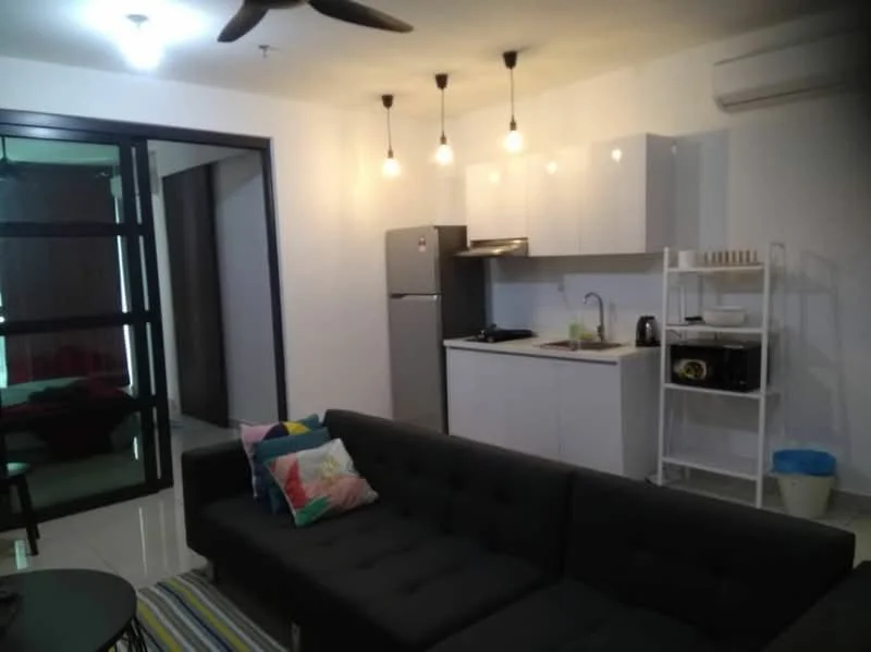 Living features: 3-seater fabric sofa in black, coffee table, area rug with striped pattern, wall-mounted TV, refrigerator, built-in kitchen cabinet, single-bowl stainless-steel sink, chrome pull-down faucet, 2-burner electric hob, white laminate cabinetry, pendant lighting, ceiling fan with light, wall-mounted air conditioning unit, white tiled flooring; style: modern.