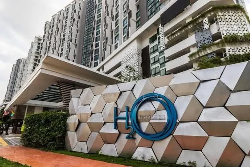 Exterior type: high-rise condominium; features: modern facade with geometric patterns, glass curtain wall, feature wall with hexagonal design, landscaped entrance with greenery, covered entrance with overhang, prominent signage, paved walkway, surrounded by urban landscape; style: contemporary.