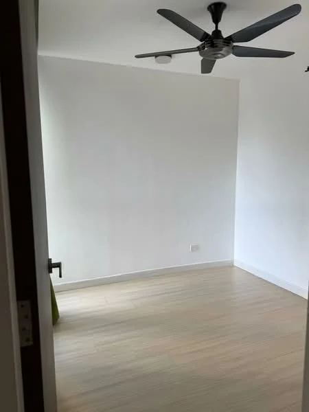 Room features: white painted walls, light wood flooring, 5-blade ceiling fan, window with no visible treatment.