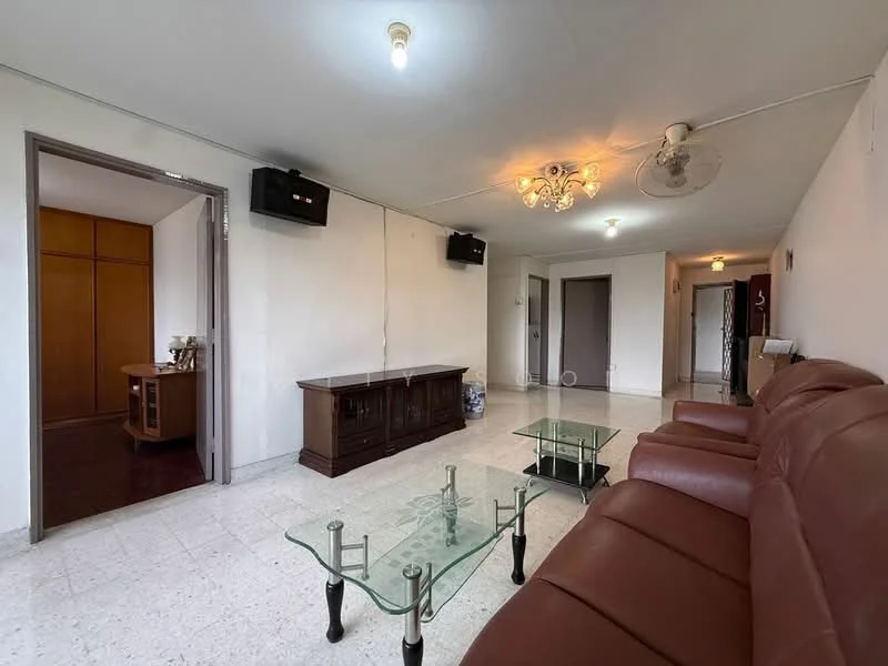 Living features: 3-seater leather sofa in brown, glass coffee table, wooden TV console, chandelier, 2 ceiling fans, white painted walls, tile flooring, wall-mounted speakers; style: modern. Room features: doorway leading to another room, doorway leading to hallway.