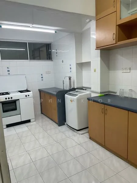 Kitchen features: white tiled walls, grey countertop, light brown wooden cabinetry, stainless-steel sink, chrome faucet, 4-burner gas hob, freestanding oven, white refrigerator, washing machine, ceramic tile flooring, fluorescent ceiling lights, window for natural light; style: modern.