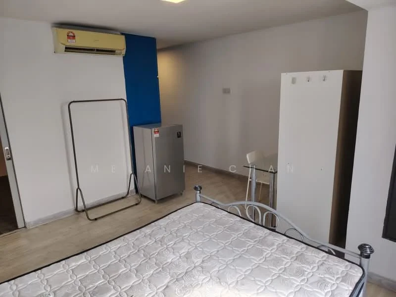 Room features: wall-mounted split AC, light grey painted walls, laminate flooring, metal bed frame, mattress, refrigerator, white wardrobe, folding chair, small table; style: modern.