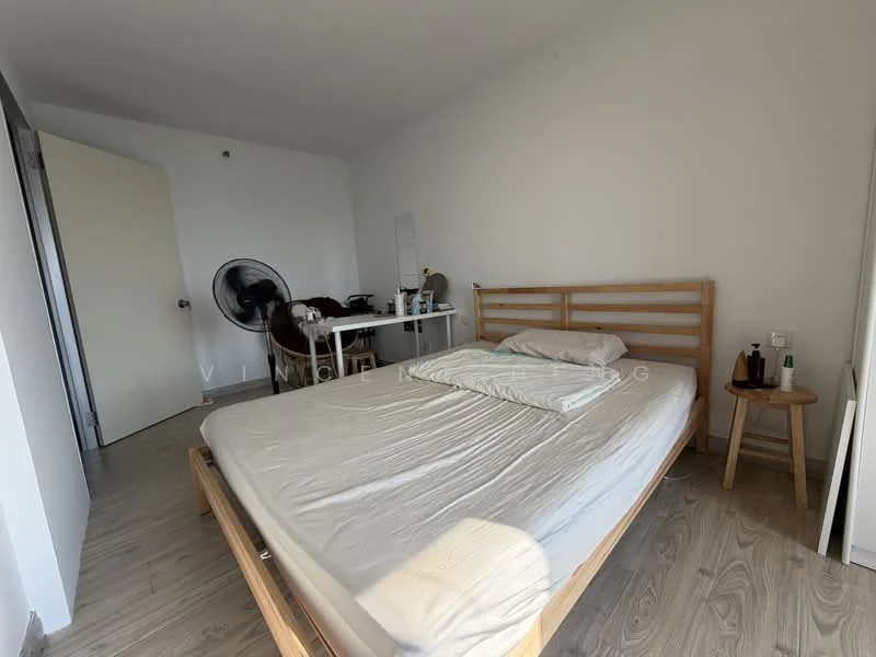 Bedroom features: queen-size bed, light grey bedding, wooden bed frame, wooden bedside stool, desk with chair, fan, white painted walls, laminate flooring; style: minimalist.