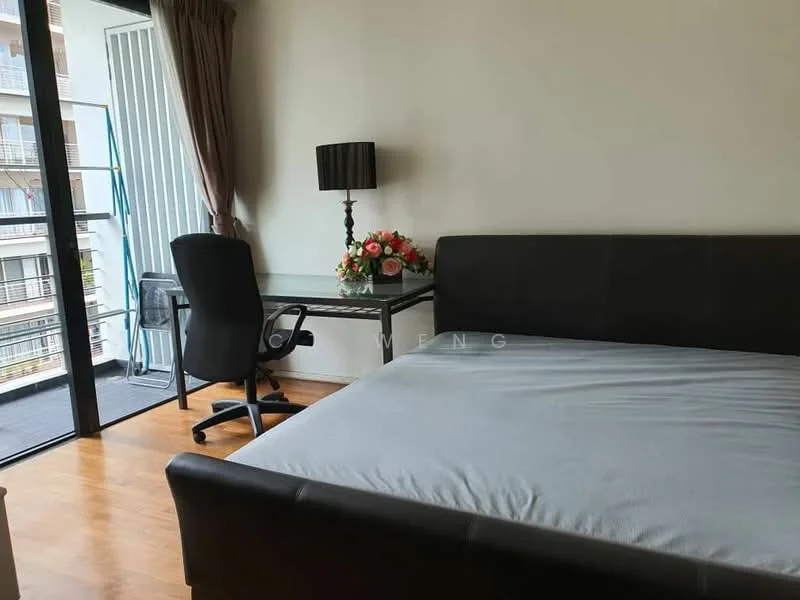 Bedroom features: queen-size bed, black leather bed frame, wooden flooring, floor-to-ceiling windows, sheer curtains, desk with chair, table lamp, decorative flower arrangement; style: modern; view: city.