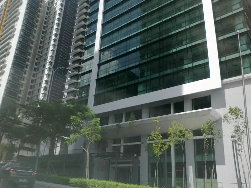 Exterior type: high-rise condominium; features: glass curtain wall, white painted facade, recessed balconies, landscaped greenery at base, multiple storeys, modern architectural design; style: modern.