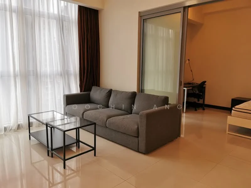 Living features: grey fabric sofa, glass coffee table with black metal frame, floor-to-ceiling windows, sheer curtains, cream painted walls, polished tile flooring, recessed downlights, black study desk with chair in background; style: modern.