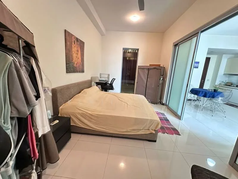 Bedroom features: king-size bed with beige bedding, white painted walls, glossy tile flooring, ceiling fan, built-in wardrobe, desk with chair, area rug with geometric pattern, sliding glass door, natural light from window; style: modern.