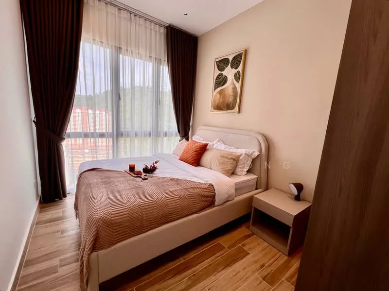 Bedroom features: king-size bed with upholstered headboard, white bedding with decorative throw pillows, wooden bedside table, decorative vase on bedside table, floor-to-ceiling windows with sheer curtains, brown accent wall, wooden flooring, framed artwork on wall, built-in wardrobe; style: modern; view: city.