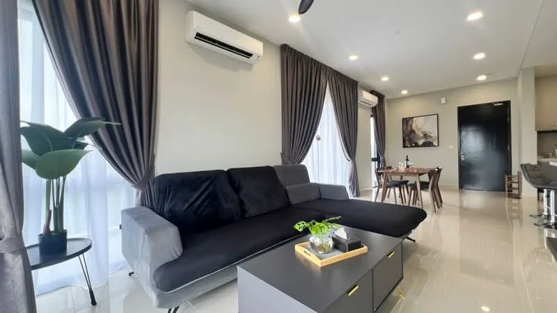 Living features: black fabric sofa, coffee table, floor-to-ceiling windows, sheer curtains, blackout curtains, recessed LED downlights, 1 wall-mounted split AC, decorative plant in ceramic pot, artwork on wall, dining table with chairs in background, glossy tiled flooring, neutral wall color; style: modern.
