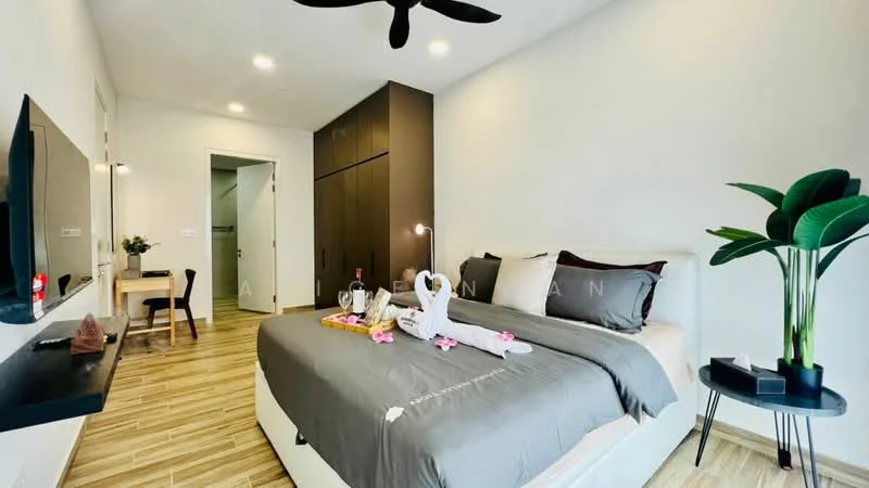 Bedroom features: king-size bed with grey bedding, upholstered headboard, wooden bedside table, wall-mounted TV, floating shelf, desk with chair, ceiling fan, laminate flooring, decorative plant, wall closet, white painted walls, doorway leading to bathroom; style: modern.