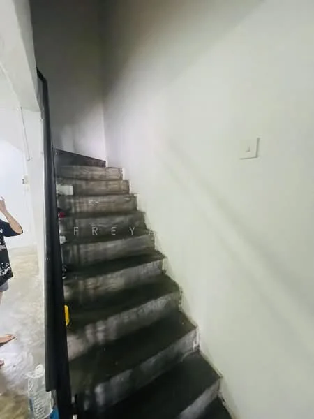 Room features: concrete staircase, white painted walls, mirror on wall, tile flooring, handrail on staircase.