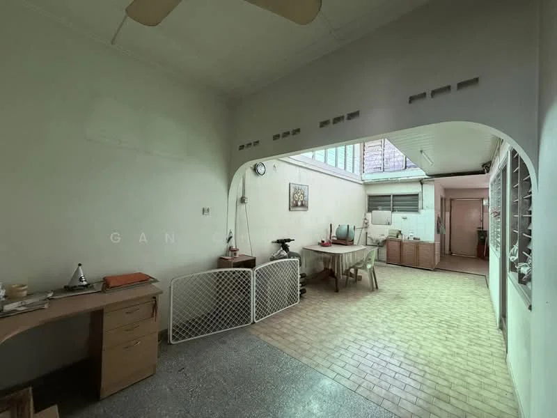 Room features: white painted walls, grey tiled flooring, ceiling fan, arched doorway, wooden desk, window with metal grilles, light fixtures, open layout, natural light from windows, partitioned area; style: minimalist.