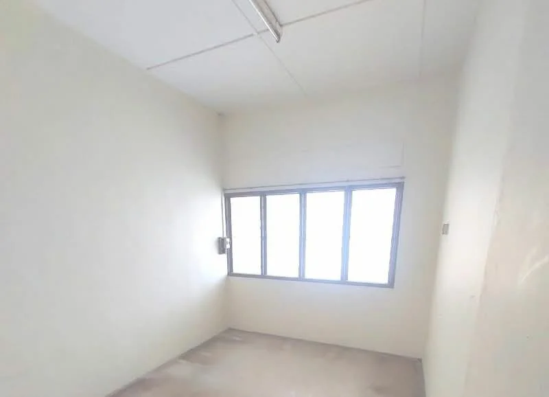 Room features: white painted walls, concrete flooring, large windows, natural light, ceiling light fixture, no visible furniture; style: minimalist.