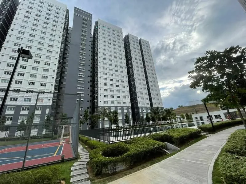 Exterior type: high-rise condominium; features: multiple-storey building, glass windows, balconies on upper floors, tennis court, manicured landscaping, paved walkway, surrounding greenery, outdoor seating area; style: modern.
