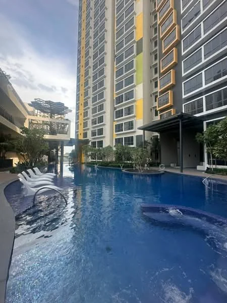 Exterior type: high-rise condominium; features: infinity pool, pool deck with loungers, landscaped garden, surrounded by greenery, modern facade with large windows, balconies on upper floors, outdoor seating area, water feature, paved walkway; style: modern.