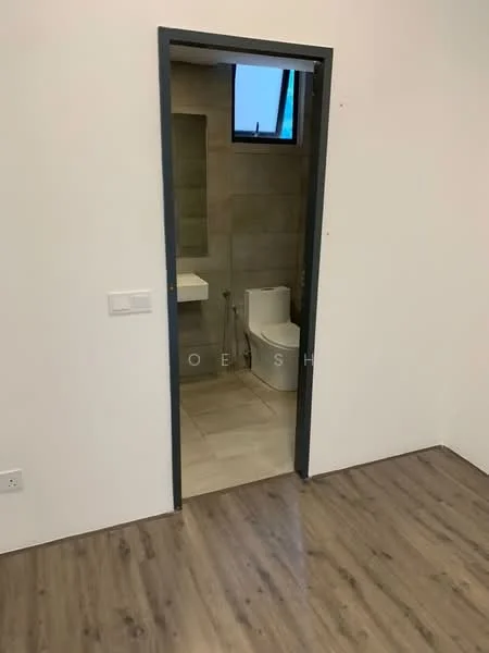 Room features: light wood laminate flooring, white painted walls, door frame, door handle, visible bathroom door, window in bathroom, tile flooring in bathroom, toilet visible through door.