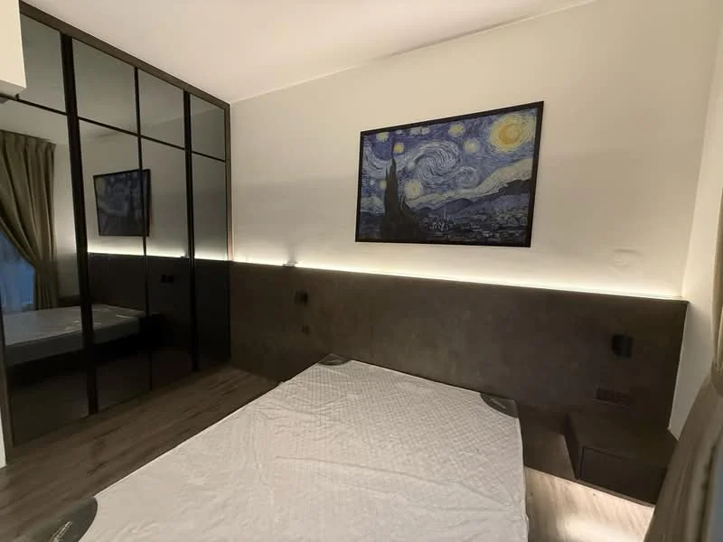 Bedroom features: wooden flooring, white painted walls, dark accent wall, framed artwork, built-in wardrobe with mirrored doors, bedside lamps, LED strip lighting, queen-size bed, curtains, nightstand; style: modern.