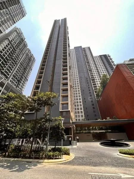 Exterior type: high-rise condominium; features: glass curtain wall, grey painted facade, recessed balconies, landscaped entrance, manicured lawn, surrounded by mature greenery, multi-storey structure, modern architectural design; style: modern.