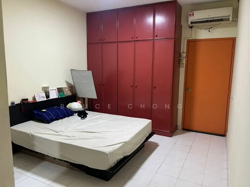 Bedroom features: single bed, built-in wardrobe with red doors, orange door, wall-mounted air conditioning unit, white tiled flooring, plain white walls, mirror on wall, decorative items on bedside table.