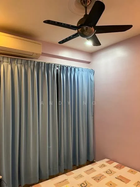 Bedroom features: blue curtains, 5-blade ceiling fan with light, wall-mounted split AC, purple painted walls, wooden flooring, bed with patterned bedding.