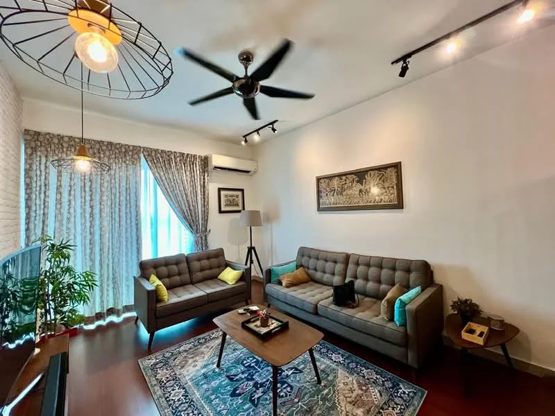 Living features: 2-seater fabric sofa in grey, 2-seater fabric sofa in grey with tufted design, coffee table, area rug with geometric pattern, wall-mounted TV, floor lamp, 5-blade ceiling fan with light, curtains with floral pattern, exposed brick wall, wooden flooring, decorative artwork on wall, decorative cushions in yellow; style: modern.