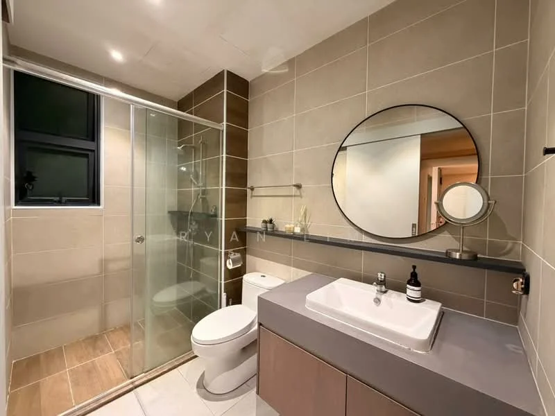 Bathroom features: grey tiled walls, light grey floor tiles, walk-in shower with glass enclosure, rain shower head, single-sink vanity with grey cabinet, white rectangular sink, chrome basin mixer faucet, round mirror, toilet, towel rack, wall-mounted shelf; style: modern.