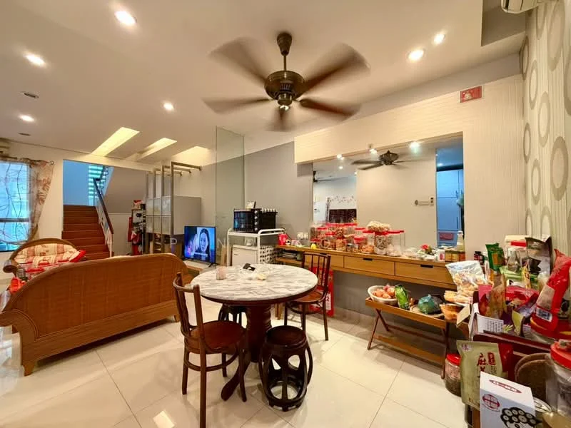 Dining features: round marble dining table, 2 wooden chairs, 5-blade ceiling fan with light, white painted walls, glossy tile flooring, open layout to living area, decorative wall with circular pattern, glass partition, kitchenette area visible, various food items on table, TV visible in background, shelves with kitchen items; style: modern. Living features: sofa set, decorative cushions, coffee table, TV console, open layout to dining area, natural light from windows, staircase visible in background; style: modern.