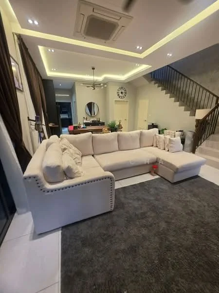 Living features: L-shape sectional sofa in beige, area rug in dark grey, recessed LED downlights, ceiling fan, wall-mounted clock, decorative wall art, large windows with sheer curtains, open layout to kitchen, staircase with wooden railing, neutral wall colour, tile flooring; style: modern.