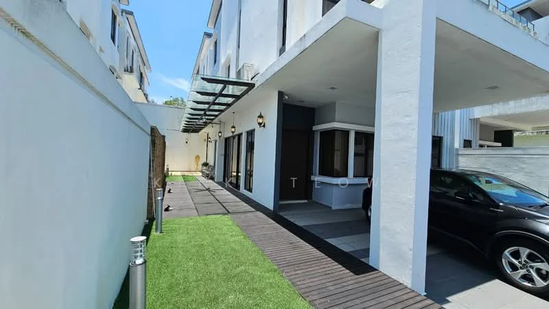 Exterior type: linked terrace house; features: manicured lawn, wooden decking pathway, white painted facade, glass awning, outdoor lighting fixtures, paved driveway, car parked, side entrance, fenced perimeter; style: modern.