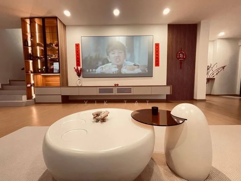 Living features: white painted walls, wood panel accent wall, light wood flooring, recessed downlights, large wall-mounted TV, low-profile media console, decorative wall art, round coffee table with black top, curved white seating, decorative vase with branches; style: modern.