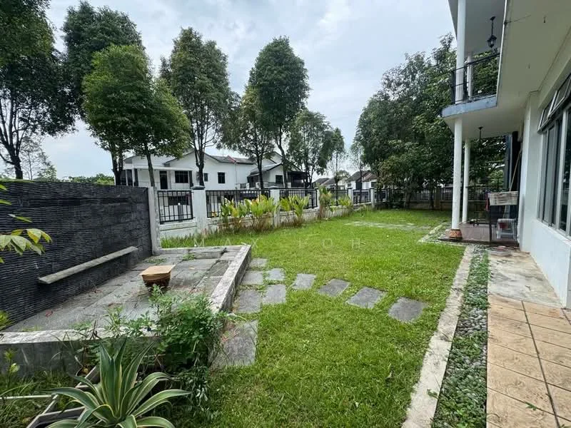 Exterior type: detached bungalow; features: manicured lawn, stone-paved walkway, landscaped garden with plants, fenced perimeter, outdoor seating area, trees providing shade, patio area with tiles, water feature wall; style: modern.