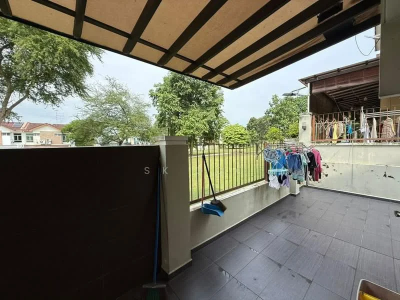 Room features: covered patio, grey tiled flooring, metal railing, outdoor clothes drying rack, broom, green lawn view, surrounding trees; view: garden.