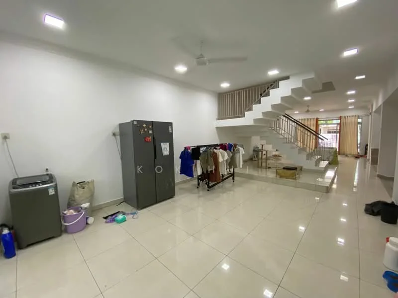 Room features: white painted walls, polished ceramic tile flooring, 5-blade ceiling fan, staircase with wooden railing, refrigerator, washing machine, clothes drying rack, open space layout, natural light from windows, decorative wall with no visible decor; style: modern.