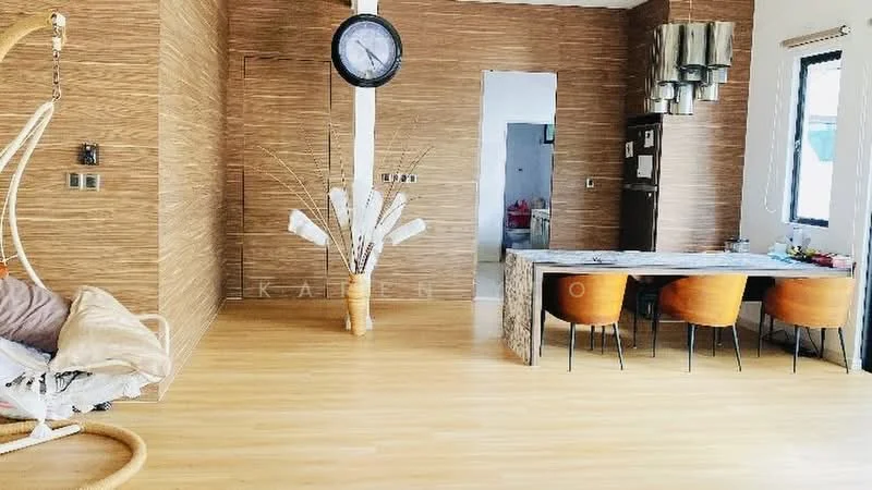 Living features: wooden flooring, feature wall with wood paneling, large wall clock, hanging pendant lights, dining table with four orange chairs, decorative floor vase with branches, open layout, large windows for natural light; style: modern.
