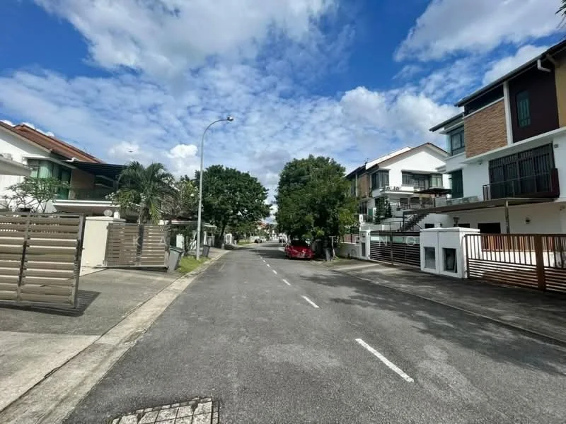 Exterior type: linked terrace house; features: paved road, street lighting, manicured trees, residential buildings on both sides, driveways visible, front gardens, clear blue sky, white clouds; style: modern.
