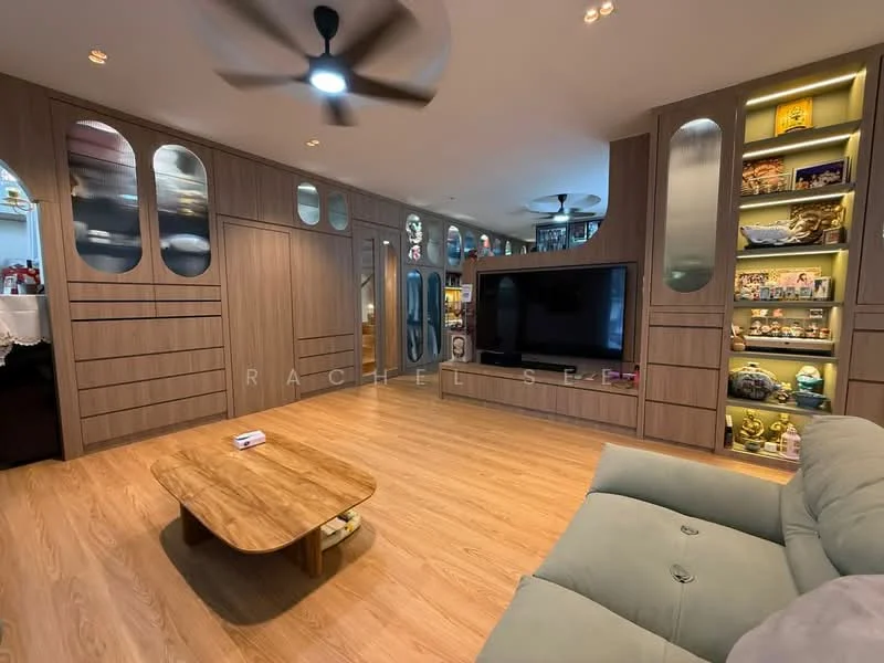 Living features: light wood flooring, built-in cabinetry with glass display shelves, wall-mounted TV, 3-blade ceiling fan, recessed lighting, decorative wall panels, coffee table, upholstered sofa in light grey, decorative items on shelves, open layout; style: modern.