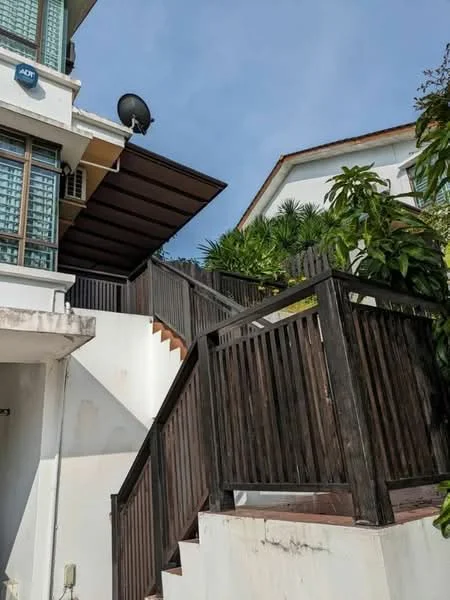 Exterior type: detached bungalow; features: wooden staircase, wooden railing, greenery landscaping, satellite dish on roof, white painted facade, overhanging roof, glass windows, paved pathway; style: modern.