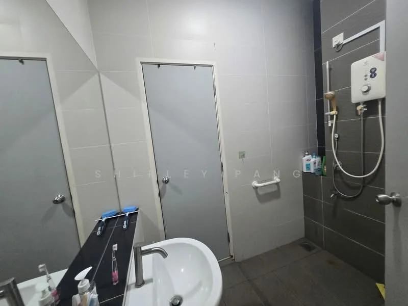 Bathroom features: single-sink vanity with dark countertop, mirror above sink, grey tiled walls, dark tiled flooring, shower area with wall-mounted showerhead, toilet, grab bar, door to shower area, door to bathroom, soap dispenser, toiletries on shelf; style: modern.