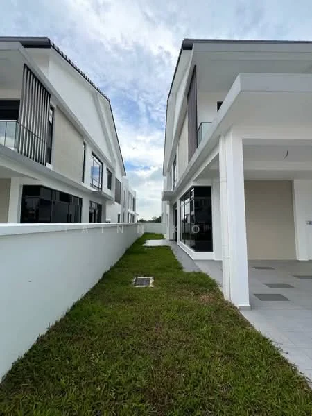 Exterior type: linked terrace house; features: white painted facade, two-storey structure, large windows, balconies on upper floors, manicured lawn, paved walkway, surrounded by greenery, modern architectural design; style: modern.