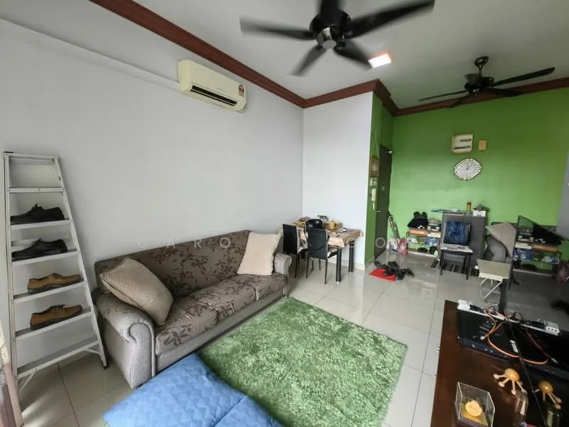 Living features: 3-seater fabric sofa in grey, green area rug, white painted walls, cream tiled flooring, ceiling fan, wall-mounted split AC, wooden ceiling trim, black dining table with chairs, open shelving unit, decorative items on shelves, television unit, various footwear on the floor; style: modern.