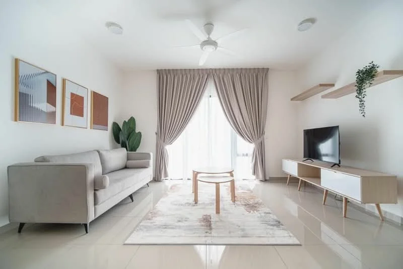 Living features: 3-seater fabric sofa in light grey, round coffee table, area rug with geometric pattern, wall-mounted TV, TV console with white and wood finish, floor-to-ceiling windows, sheer curtains, ceiling fan with light, decorative wall art, potted plant, built-in shelving; style: modern.