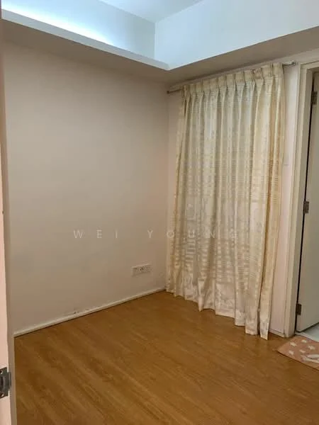 Room features: light wood flooring, white painted walls, curtains in cream color, door leading to another room, corner of the room with no visible furniture.