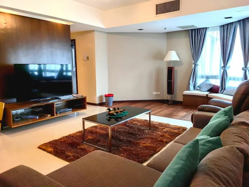 Living features: 3-seater fabric sofa in grey, 2-seater fabric sofa, coffee table with glass top, area rug with brown and cream pattern, wall-mounted TV, TV console with storage, lampshade floor lamp, large windows with sheer curtains, wooden flooring, cream painted walls, recessed downlights; style: modern.