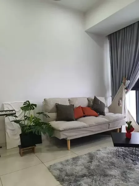Living features: light grey fabric sofa, orange and grey decorative cushions, white walls, large window with sheer curtains, grey curtains, indoor plants in pots, area rug with fluffy texture, black coffee table, keyboard instrument on stand; style: modern.