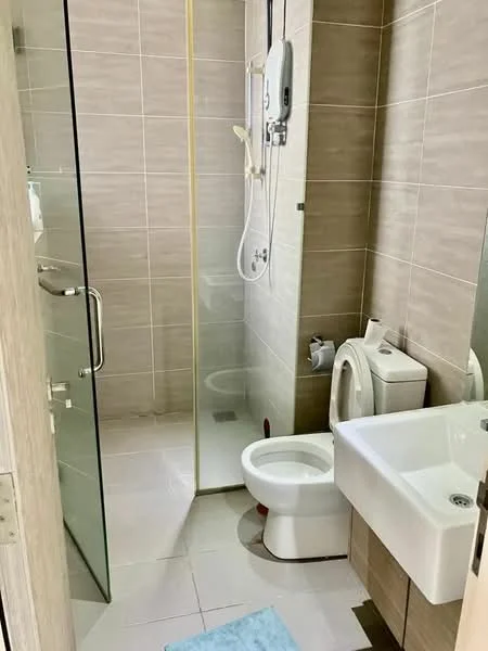 Bathroom features: walk-in shower with glass enclosure, chrome handheld shower, white ceramic toilet, single-sink vanity with wood cabinet, chrome basin mixer, mirror above sink, grey tiled walls, white tiled flooring, wall-mounted water heater, towel rack; style: modern.